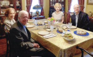 In this Norman Rockwell-like photo taken at the Cooks’ Plains, Pa. home in 2013, Diane and Larry Cook host a dinner with Plains, Ga.’s most famous inhabitants, President Jimmy Carter and his wife Rosalyn, who passed away on Sunday, Nov. 19 at the age of 96.
                                 Submitted Photo